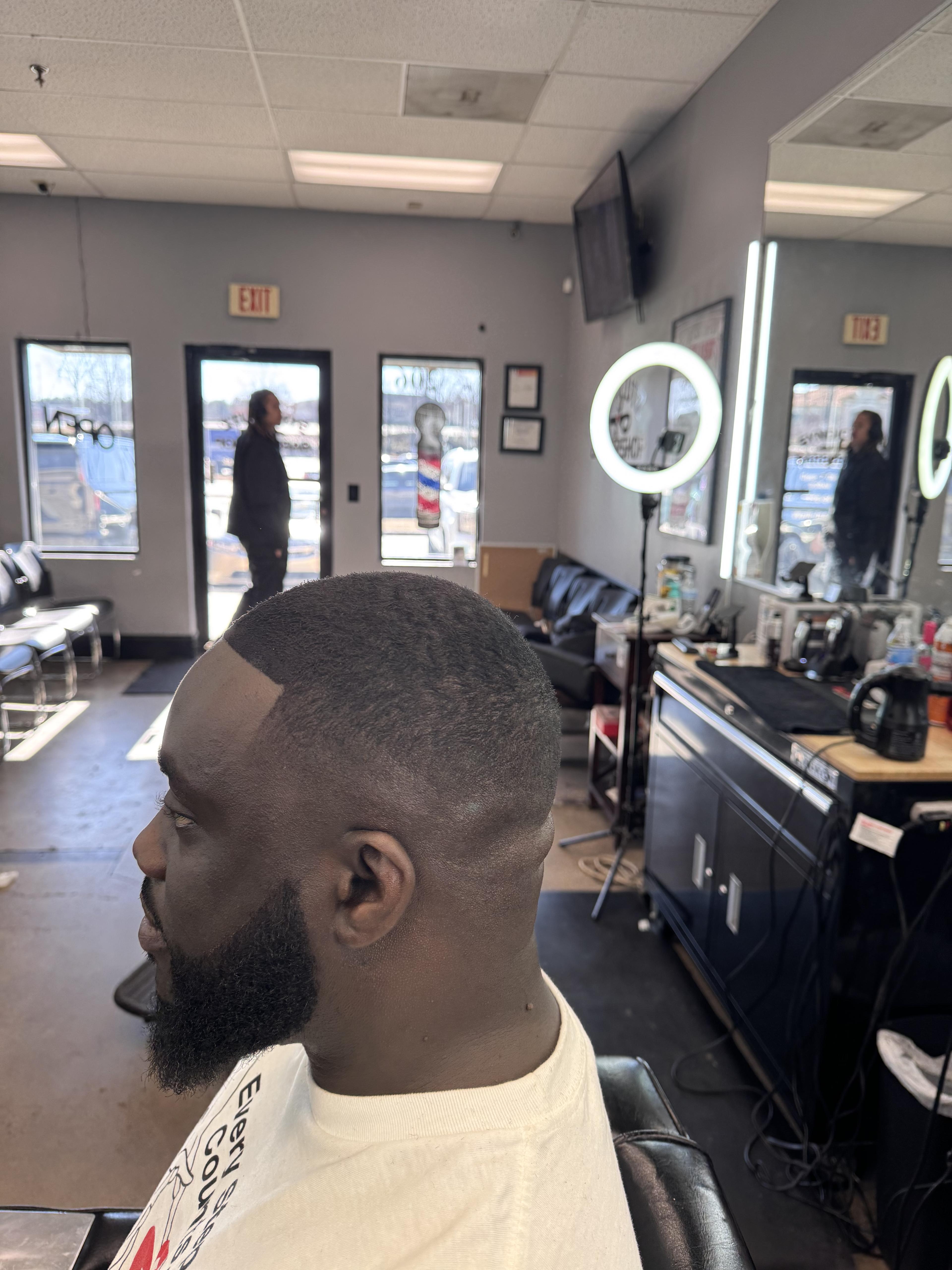 Client beard and fade detail inside the barbershop