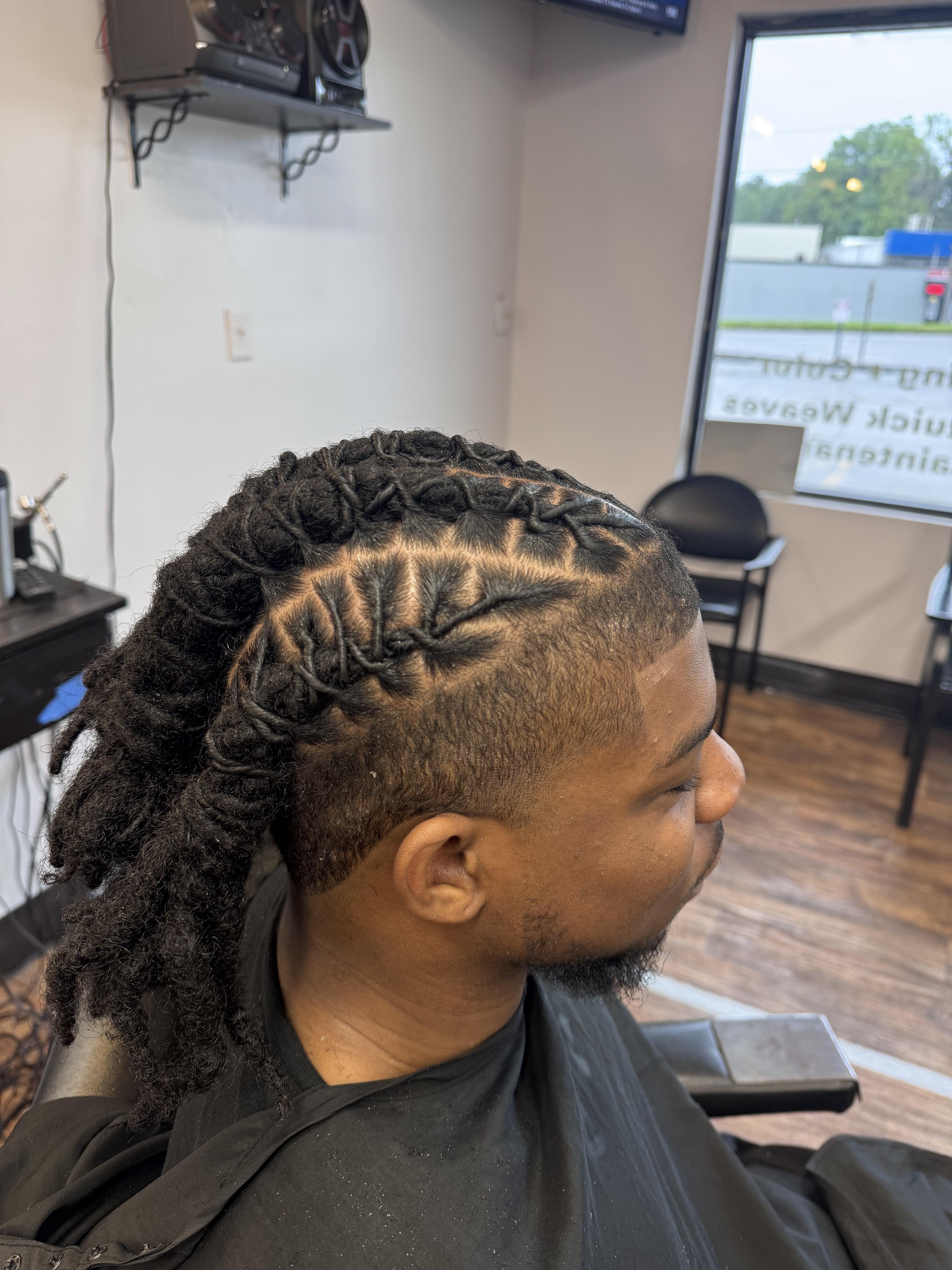 Client loc style with clean parting and taper detail